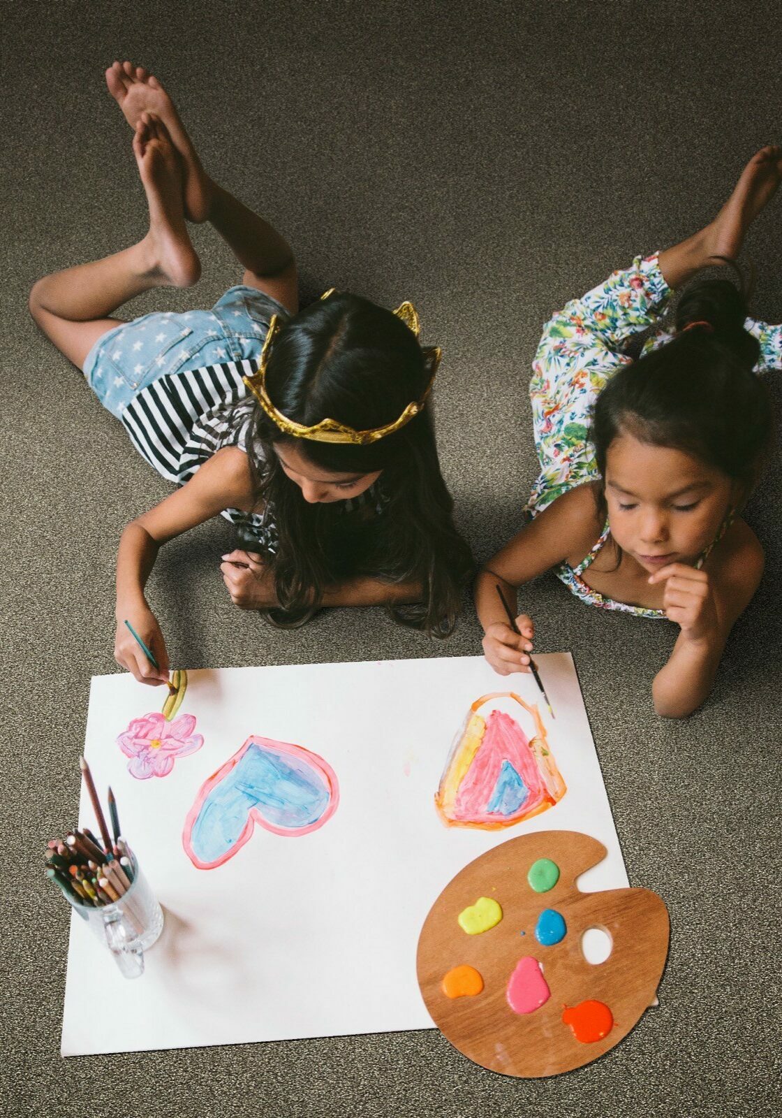 Kids drawing laying on soft Carpet | Raider Flooring